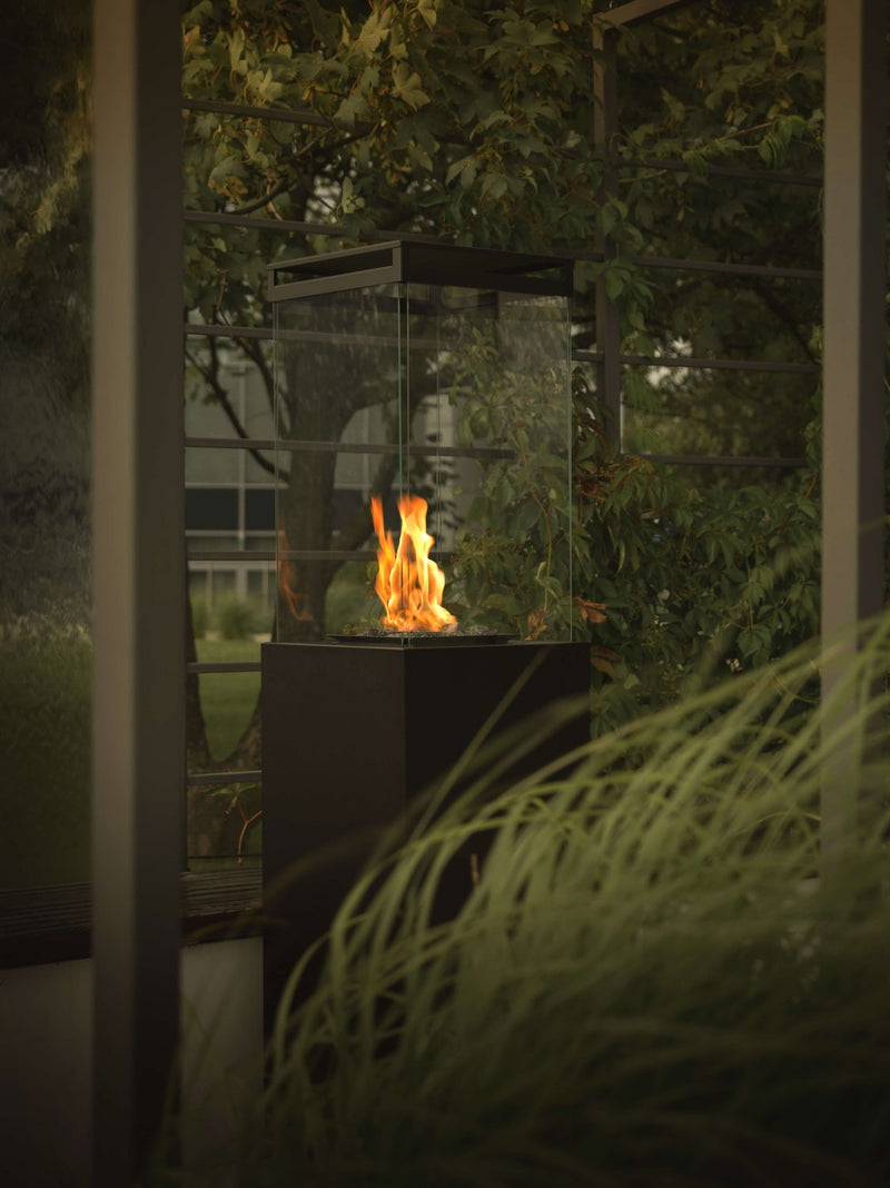 Load image into Gallery viewer, Planika Lighthouse gas patio heater in modern outdoor patio setting with warm flame ambiance
