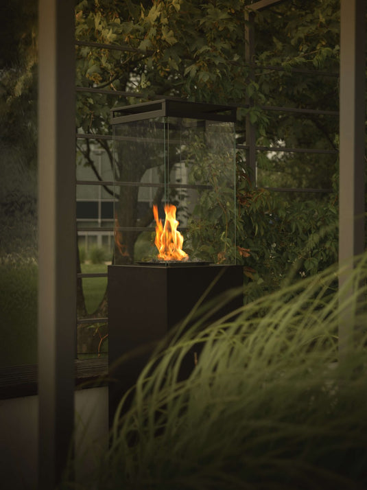 Planika Lighthouse gas patio heater in modern outdoor patio setting with warm flame ambiance