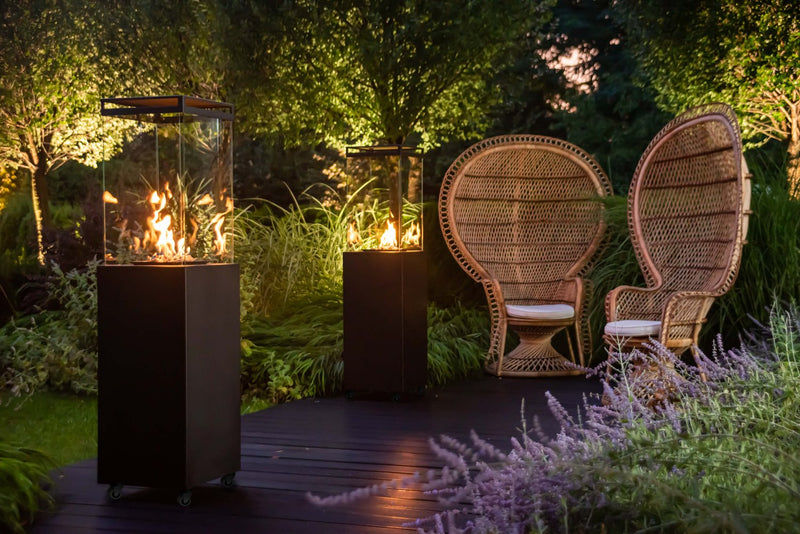 Load image into Gallery viewer, Planika Lighthouse gas patio heater in modern outdoor patio setting with warm flame ambiance
