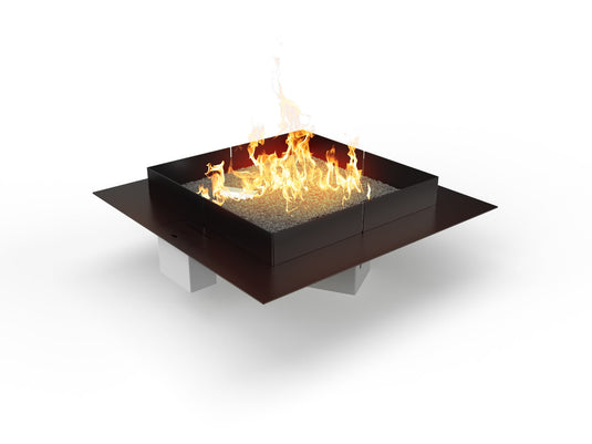 Planika Mico 800 automatic outdoor gas burner with star-shaped flame design in large fire pit installation
