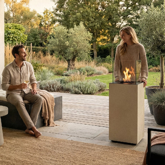 Planika Porto Nacre freestanding fireplace used in a modern outdoor lounge area
