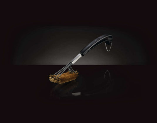 Triple-row grill brush with brass bristles and curved handle for cleaning cast iron cooking grids